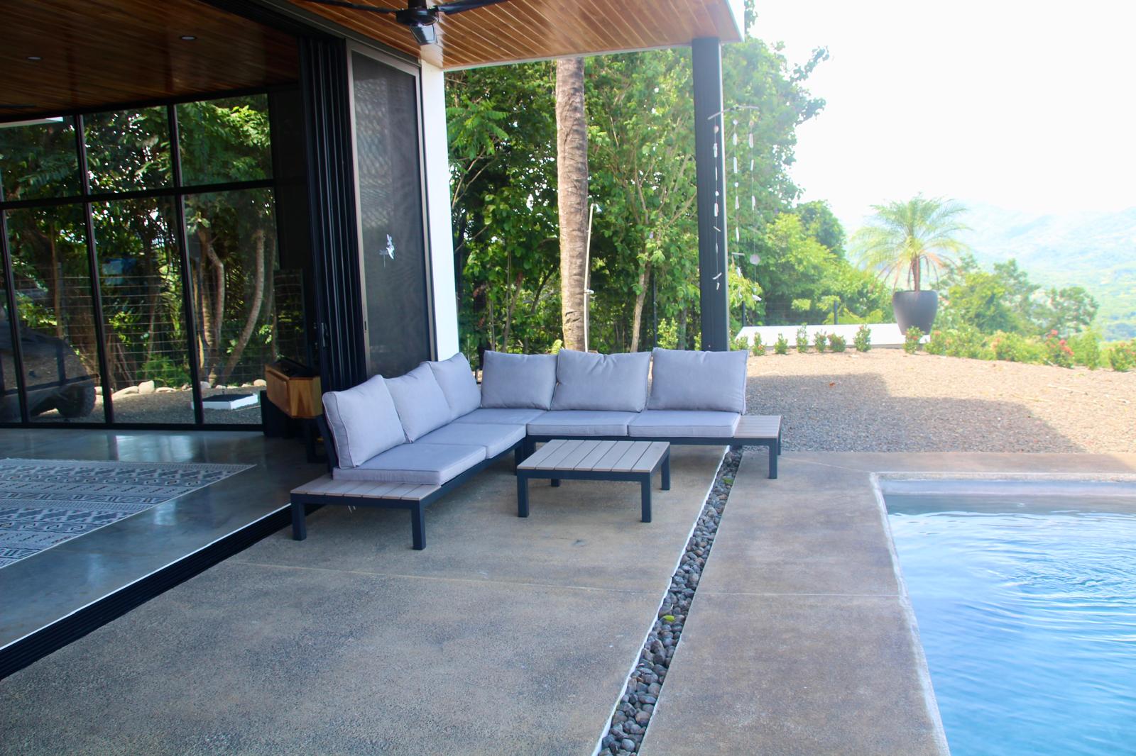 Casa Playa Carrillo — outdoor sectional lounge on the pool terrace